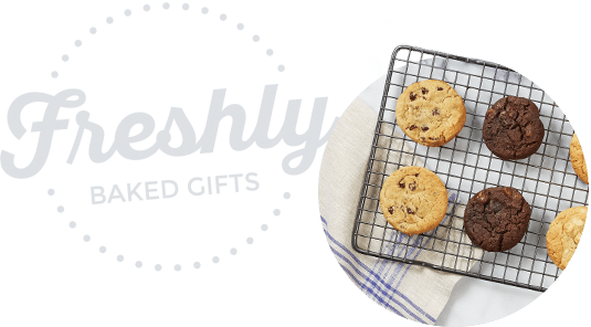 Cookies on a rack with the word freshly baked